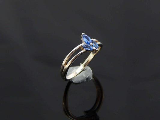 Genuine Kyanite Flower Ring in 925 Sterling Silver with marquise cut gemstones and split band design.