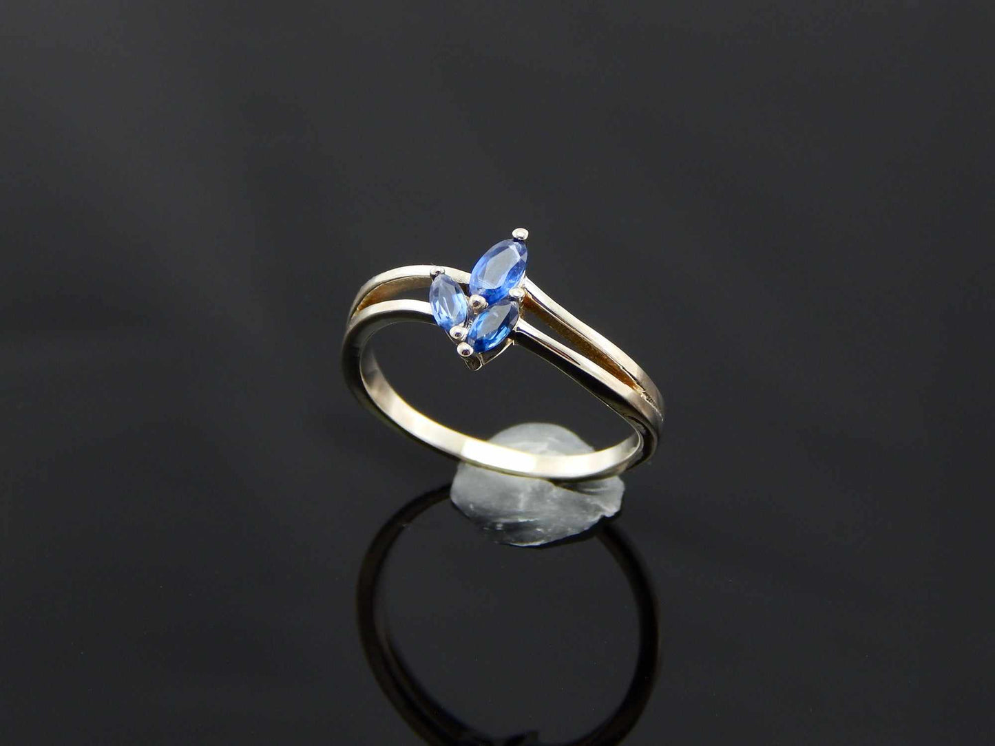 Genuine Kyanite Flower Ring in 925 Sterling Silver with marquise cut gemstones.