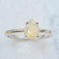 Opal Pear Cut Ring - Silver featuring a 10x8mm genuine opal gemstone in a 925 silver prong setting with a slim 2mm band.
