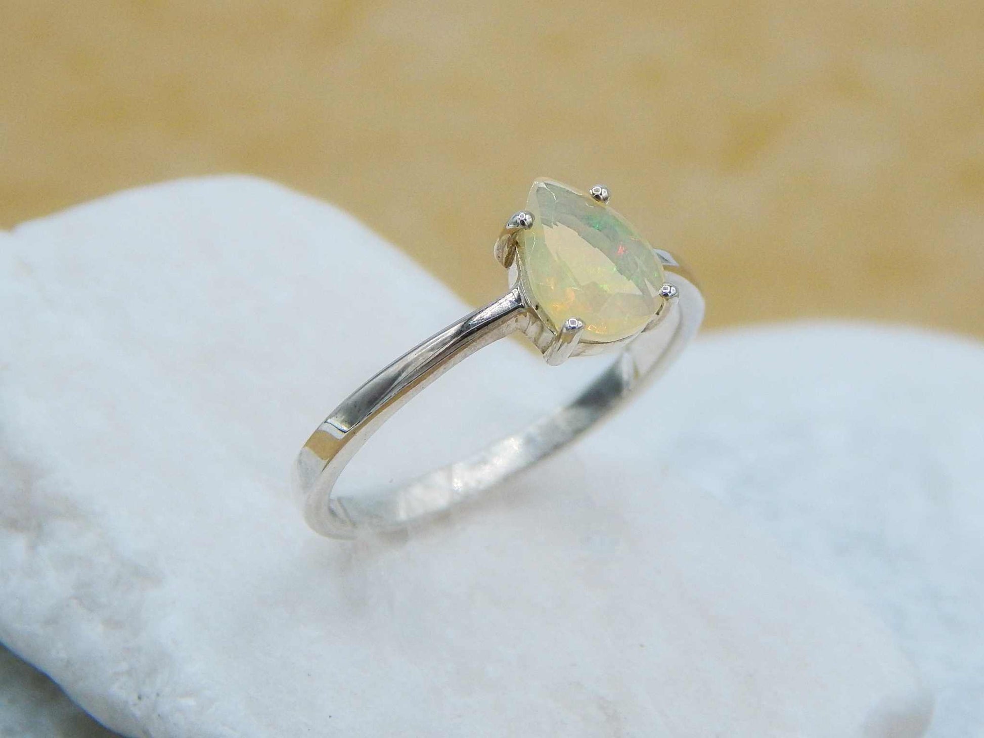 Genuine Opal Pear Cut Ring in 925 Silver with a faceted teardrop opal set on a polished silver band, ideal for minimalist jewelry lovers.