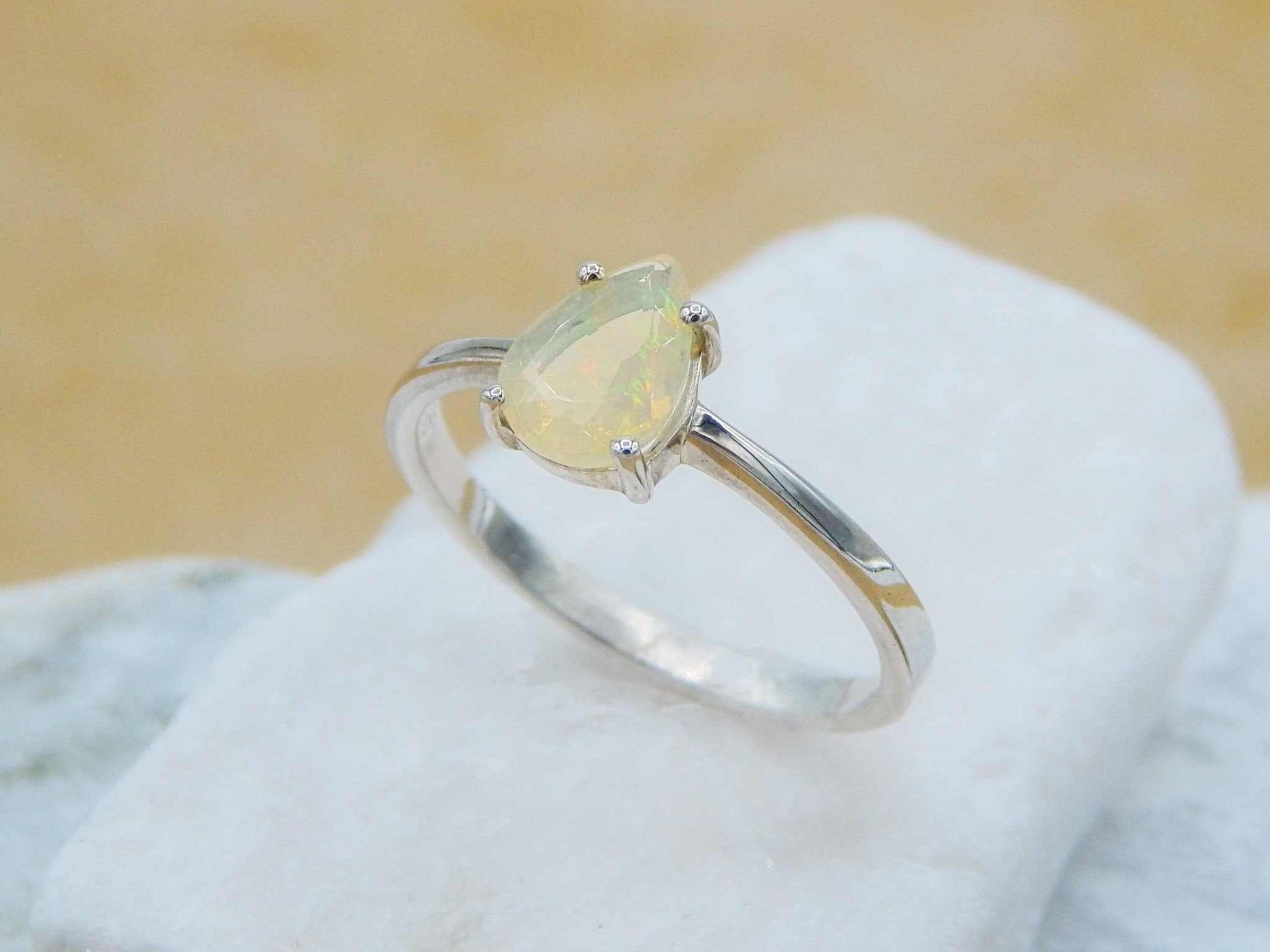 Elegant Opal Pear Cut Ring - Silver with semi-precious opal gemstone in a classic prong setting, perfect for everyday wear or gifting.