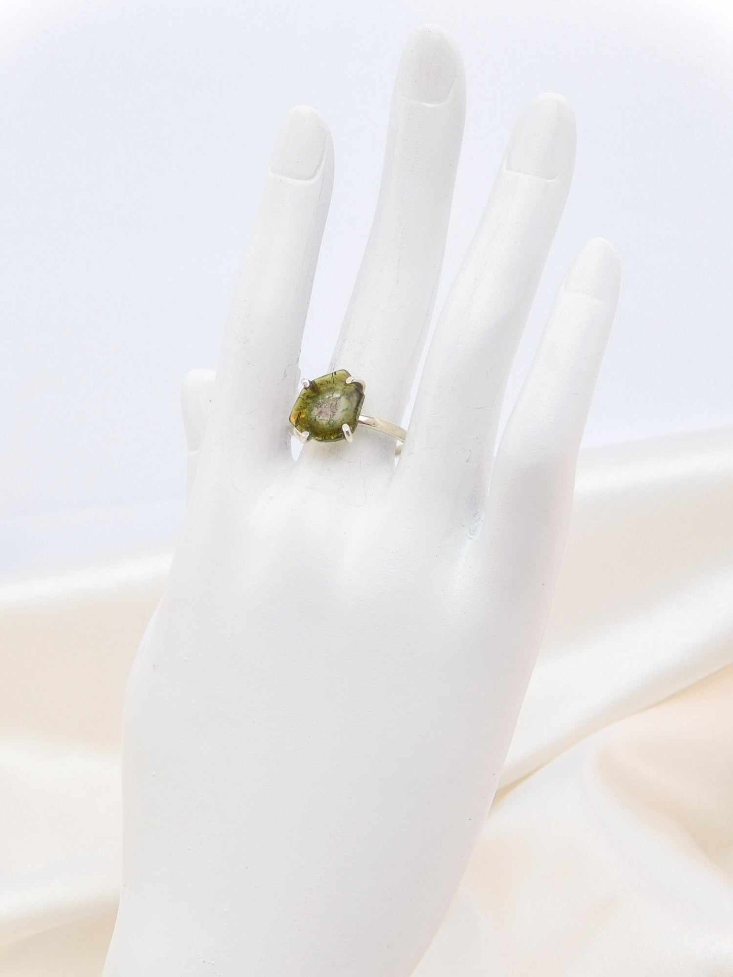 Genuine rough cut watermelon tourmaline ring on mannequin hand in 925 sterling silver.
