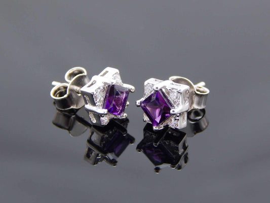 Cushion cut amethyst sterling silver stud earrings with cubic zirconia.