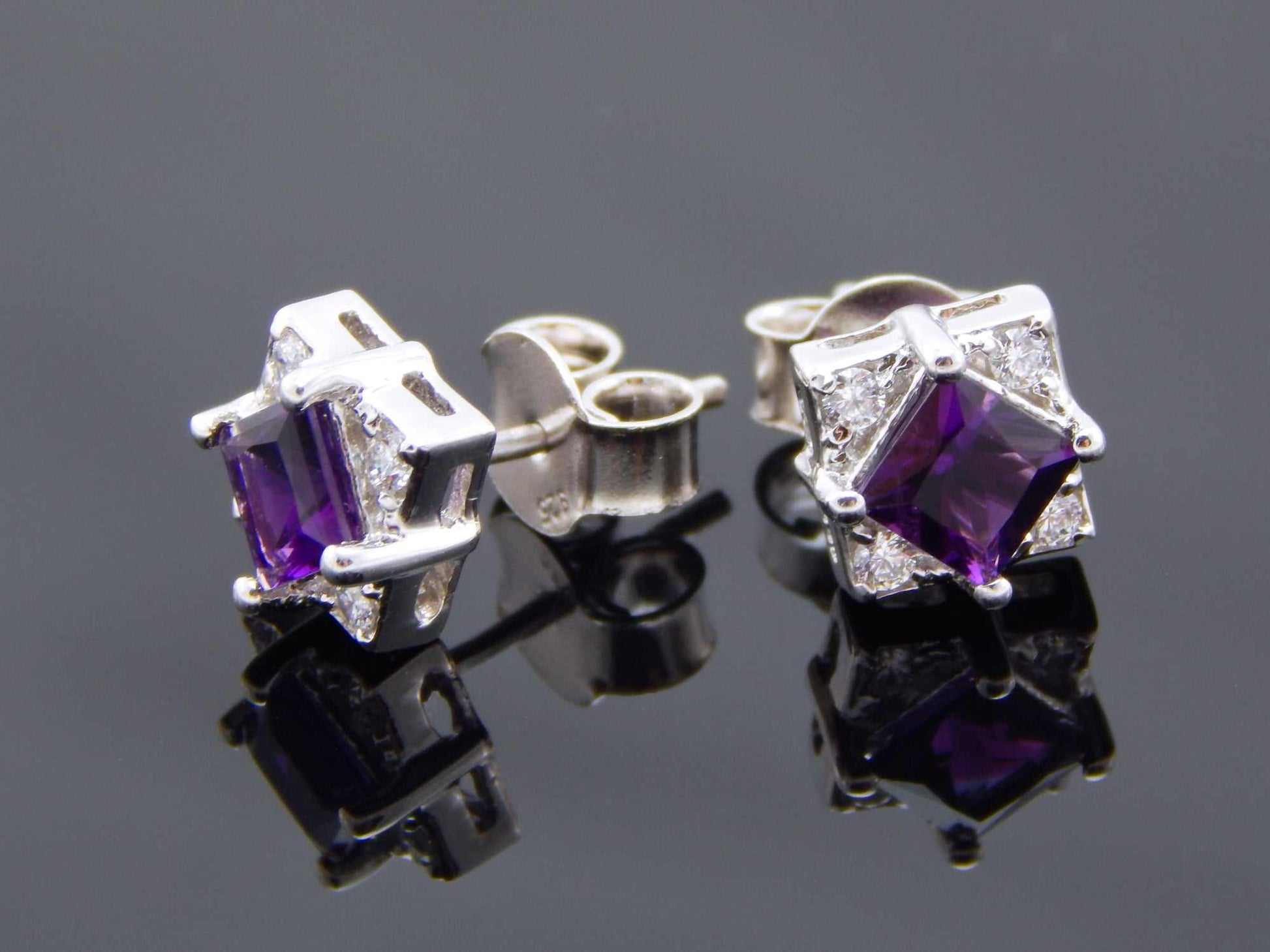 Genuine purple amethyst cushion cut stud earrings in 925 sterling silver.